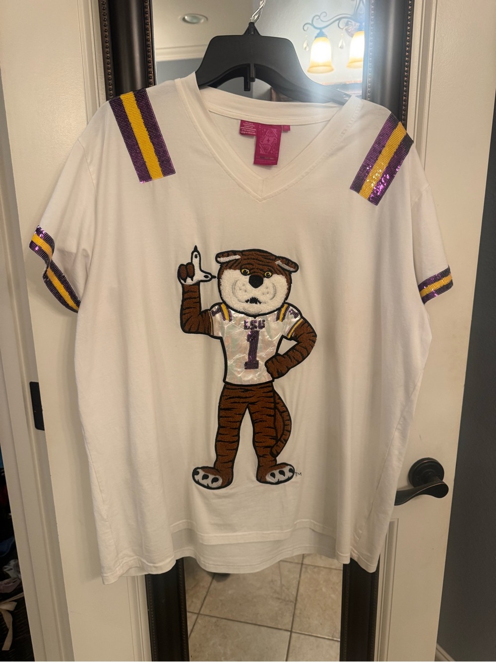 QUEEN OF SPARKLES White V‑Neck Sequin Mascot Tee with Purple & Gold Stripes